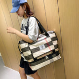 Sac de voyage pliable à carreaux